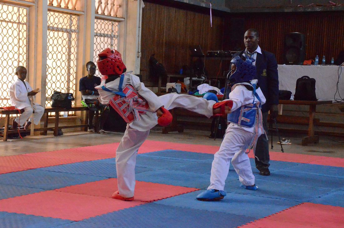 Children in white karate uniforms training together