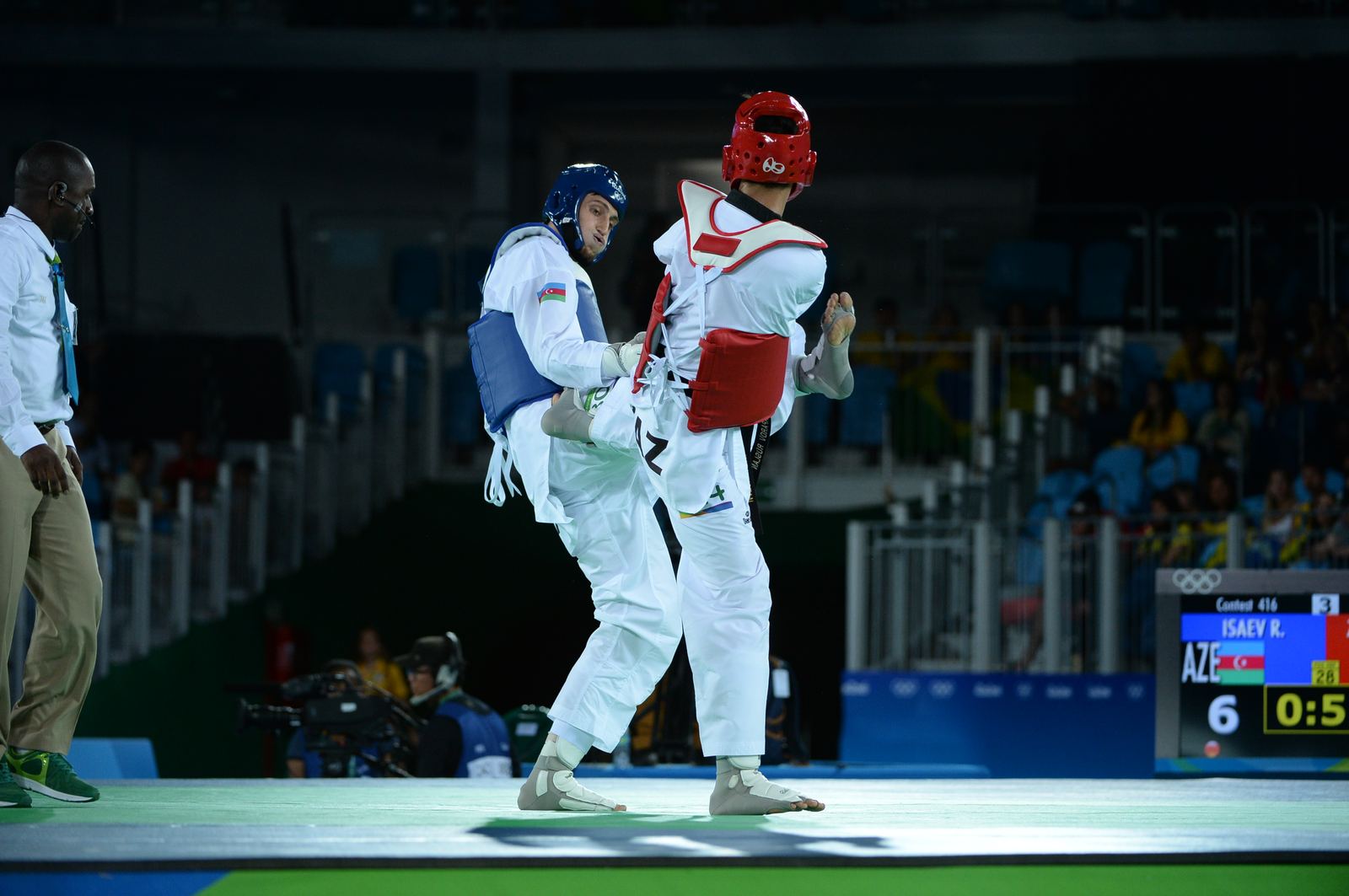 Two taekwondo athletes in protective gear competing at the Rio 2016 Olympics
