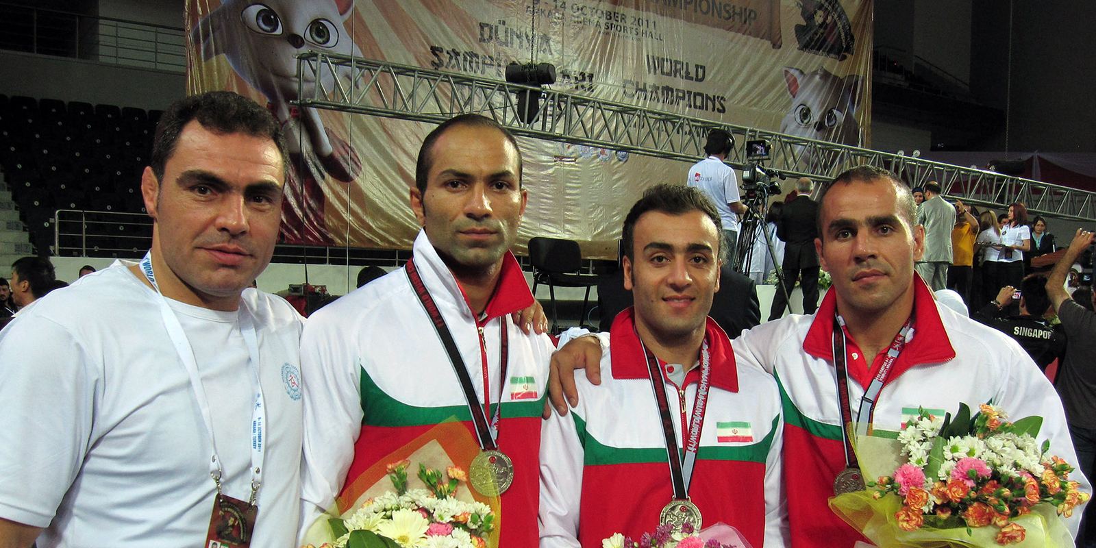 A national wushu taolu team with their medals and flowers